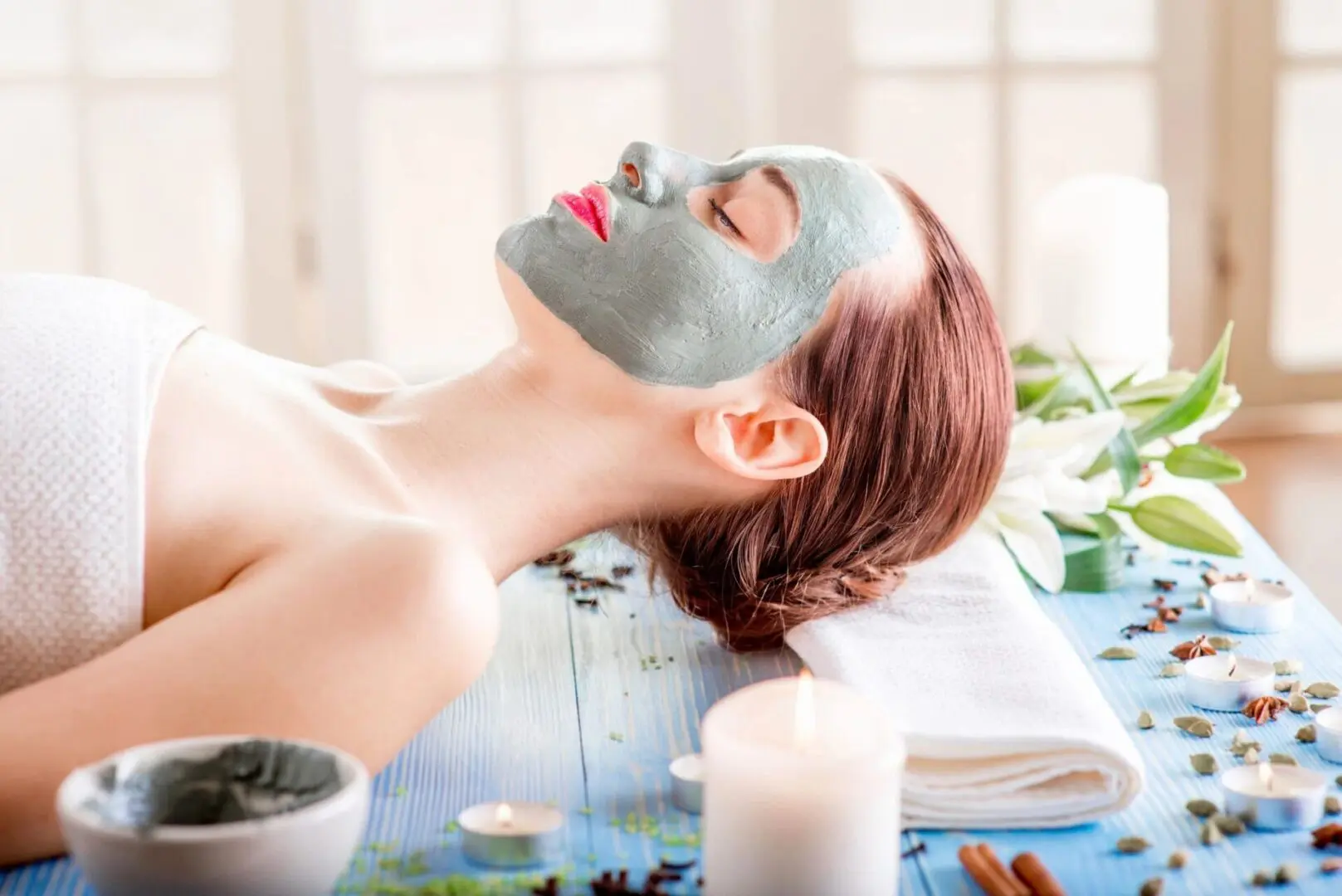 A woman with a face mask on laying down