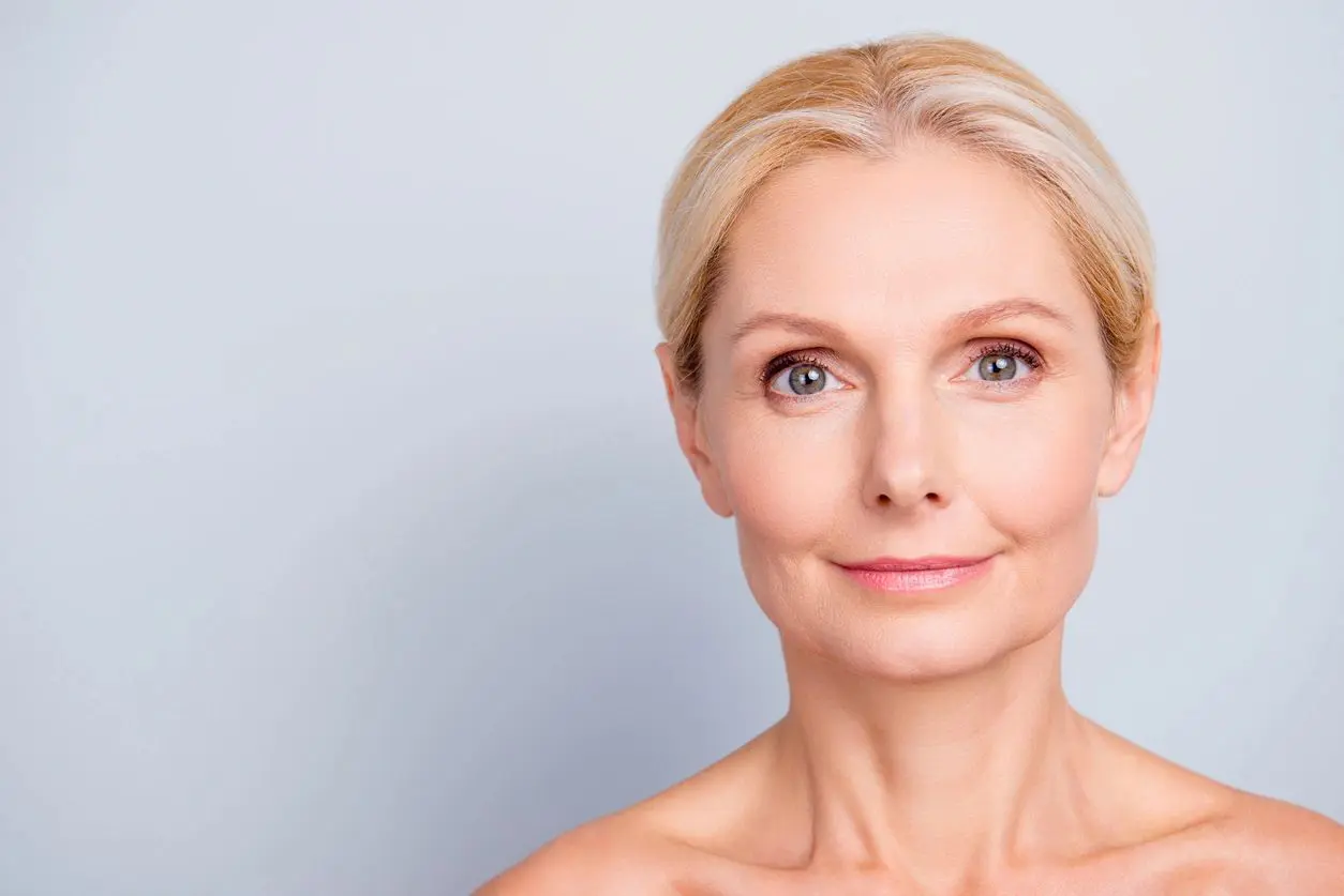 A woman with blonde hair and blue eyes.