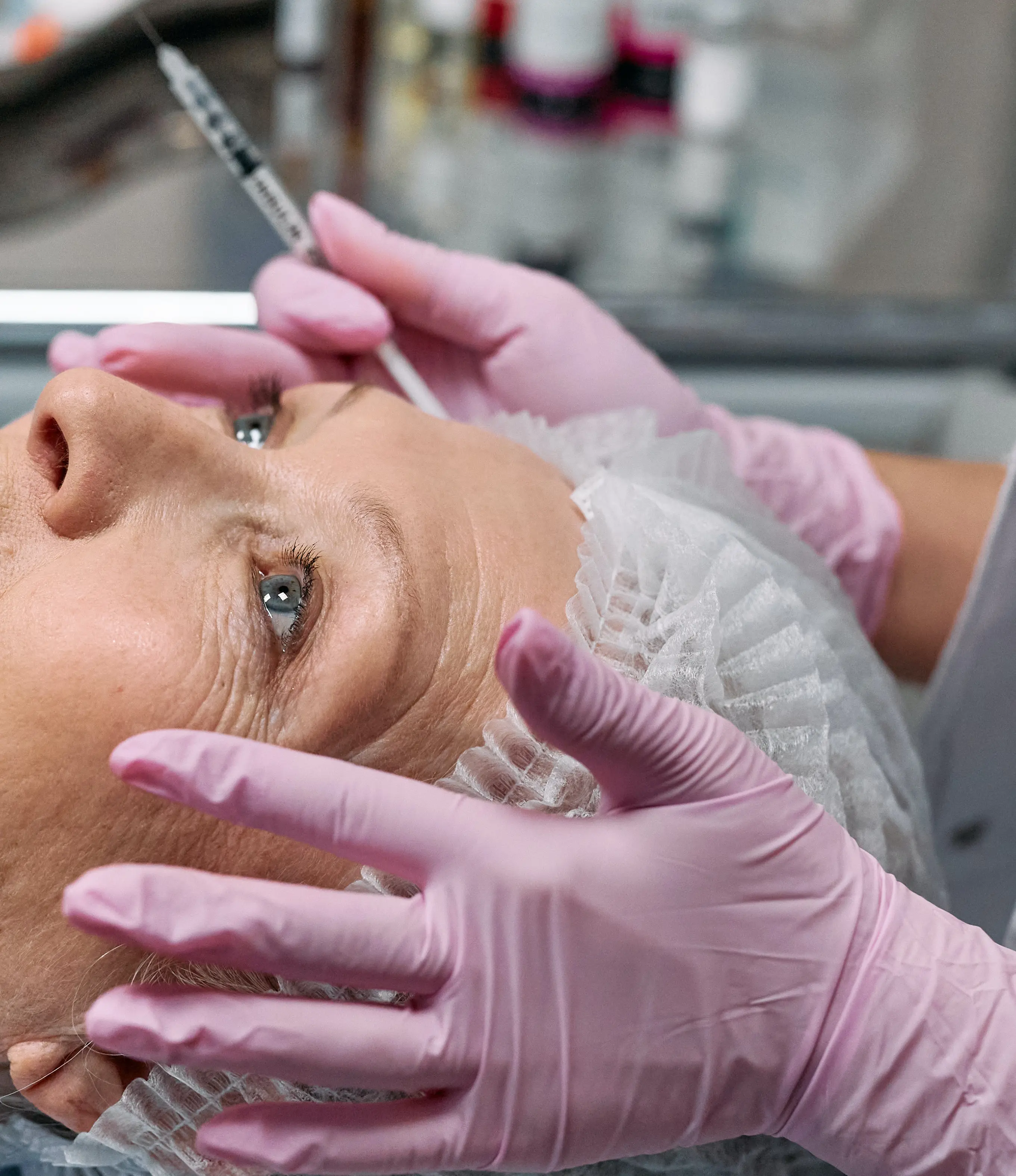 A woman getting her face waxed at the salon